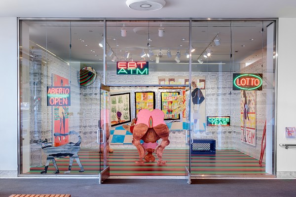 Installation view of a gallery space behind a glass wall with two open glass doors. A number of neon signs are displayed in the window, reminiscent of a storefront. On our left, the first sign reads, "Abierto, Open" all in orange neon capital letters with a green line between the first and second word. The next sign reads,"EBT, ATM" in orange and then green capitals. A sign towards the back of the store reads, "Coffee, Teas" in green neon capitals. At the furthest to our right, we can see a sign reading "Lotto" in orange capitals surrounded by a green neon circle. In the left window is a large grey and black cat sculpture. Directly in front of the open glass doors is a sculpture of a woman bending over with her head on the ground. Various other objects and wall works fill the gallery space.