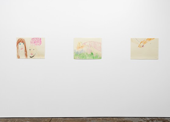 Second 3 of 6 drawings hanging in a single line next to each other. From left to right: “Self portrait with London and couch”. The artist, Emilie is on the left. She has long brown hair, blue eyes, pink lips, and is wearing a white t-shirt. London looks at an angle down to the right side of the drawing, and the couch floats above her head.&nbsp;. . To the right of that, is a fantastical drawing, “London in the Presence of the Goddess”. The goddess Venus is bare-breasted with long wavy blonde hair, reclines on a bed with a sheet loosely covering her legs. She is propped up on one elbow, and extends her left arm, reaching down towards London. London stands on all fours at the foot of the bed, about to touch the goddess’s hand with her nose. They are outside in nature, with flowers in the grass below London’s feet.&nbsp;. . The last drawing on the right is, “Hand in Paw”, a simple drawing of a human hand wrapping its fingers around London’s paw, as if they were holding hands on a walk.