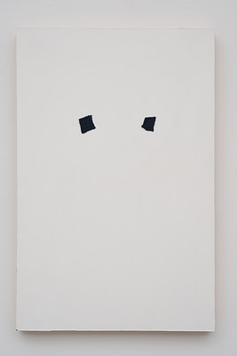 Close view of a painting seen in previous installation images hanging on a white wall. The painting is in portrait format, and primed in white. Just above the center of the painting, we can see two square pieces of dark blue or black cloth mounted directly onto the canvas. They sit at the same distance apart from each other as to the vertical edges of the canvas. They are slightly tilted outwards. Below the painting, we can see a subtle drop shadow on the wall.